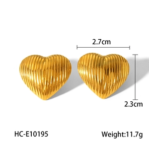 Minimalist 18k gold heart-shaped earrings with vertical stripes on white background