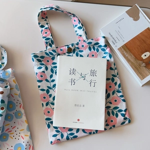 Close-up of vintage metal snap button on floral pattern cotton canvas handbag