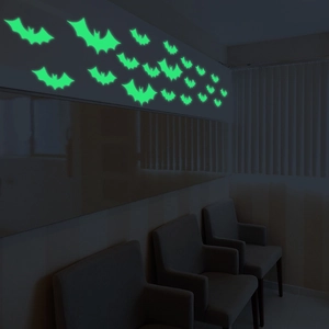 Glow-in-the-dark green bat wall stickers for Halloween festive home decor in dark setting