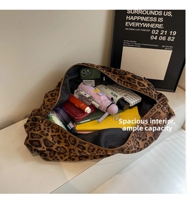 Interior view showing the large capacity and storage of the leopard print tote bag