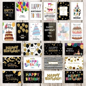 Flat lay of multiple 3D pop-up birthday cards with colorful fireworks on a wood surface
