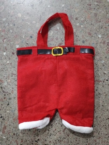 Detail of Christmas Santa pants gift bag with felt fabric and black belt decoration