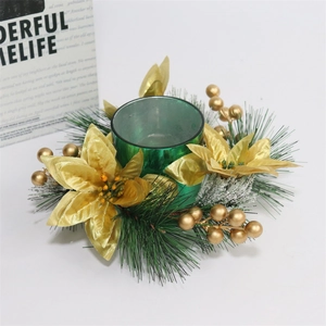 Golden poinsettia Christmas candle ring with frosted pine needles and green glass holder