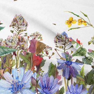 Close-up detail of bohemian floral tapestry fabric showing soft folds and watercolor print