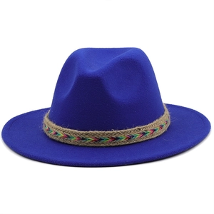 Detail of royal blue wool fedora featuring a colorful bohemian embroidered rope band