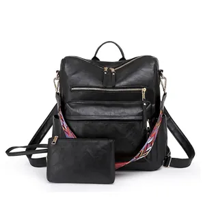 Retro black leather backpack set for women with ethnic strap and matching clutch pouch