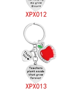Detail of teacher gift keychain with red enamel apple and engraved thank you charms