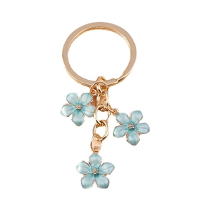 Sweet cherry blossom keychain with blue enamel flowers and golden metal ring