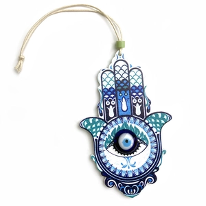 Wooden Hamsa hand wall hanging with blue evil eye and white woven rope ornament