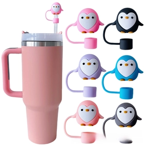 Close-up of cute 10mm penguin silicone straw covers on a 40oz pink insulated tumbler