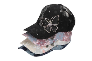 Close-up of lace floral baseball caps with sparkling rhinestone butterfly decoration