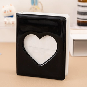 Glossy black card binder featuring a heart-shaped cutout design and sleek reflective surface