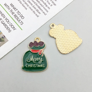 Detail of Christmas enamel gift bag pendant with Merry Christmas engraving and gold back