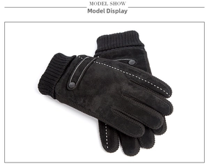 Close-up of men's winter pigskin gloves with contrast stitching and knit cuffs