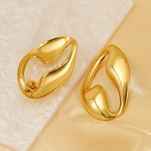 Modern irregular geometric gold hollow earrings with polished fluid abstract design