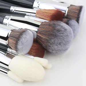 Close-up of a 30-piece makeup brush set with black handles and various soft bristle heads
