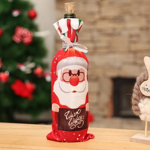 Red Christmas Santa wine bottle cover with Warm Wishes sign and silver ribbon tie