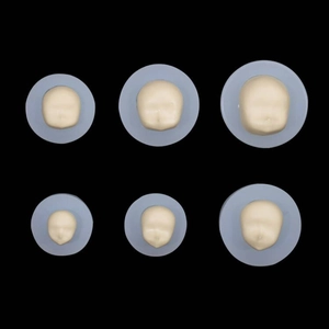 Set of 6 light blue silicone molds for doll faces in different sizes on black background