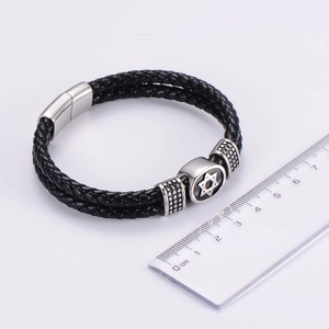 Detail of black braided leather bracelet with stainless steel hexagram magnetic clasp