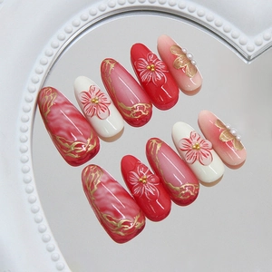 3D gold line camellia almond press-on nails with pearls and floral relief design