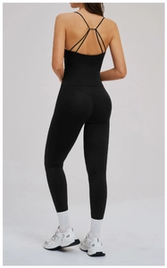 Detail of black cross-back yoga top and high-waisted leggings with elastic fabric