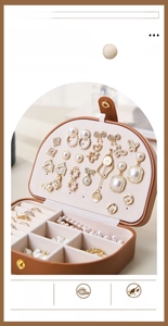 Detail view of portable jewelry box showing 40 earring holes and ring storage slots