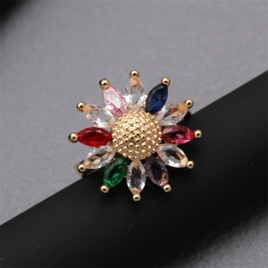 Sparkling gold sunflower ring featuring colorful zircon stones in a detailed macro view