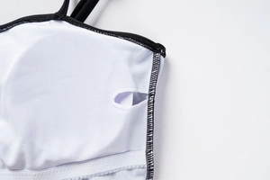 Detail view of the swimsuit inner lining with removable pad slot and flatlock stitching