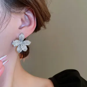 Elegant floral stud earrings with sparkling cubic zirconia on a 925 silver needle