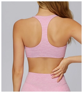 Rear view of pink racerback sports bra and high-waist leggings with heather texture