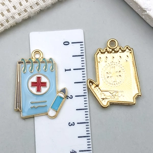 Blue medical notebook alloy pendant with red cross detail for DIY keychain making