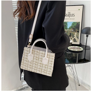 Chic beige tweed crossbody bag styled with a black blazer in a modern interior setting