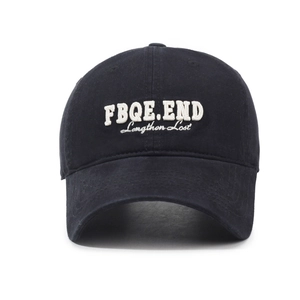 Black cotton baseball cap with white 3D letter embroidery and wide curved brim