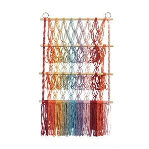 Three-tier boho macrame doll storage shelf with rainbow hand-woven cotton rope on wood