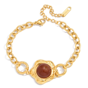 Elegant gold stainless steel bracelet featuring a red agate stone in a wavy flower base