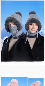 Detailed view of the winter knit hat with adjustable drawstring face mask and pom pom