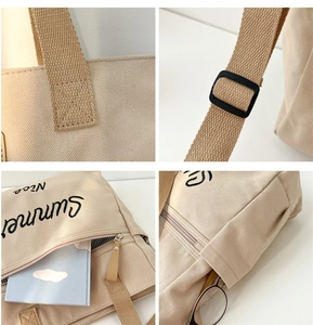 Detail view of canvas tote bag with reinforced stitching and adjustable shoulder strap