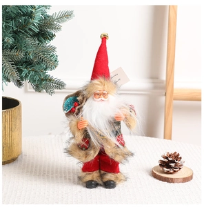Detailed view of standing Santa Claus doll with red hat and white beard Christmas decor