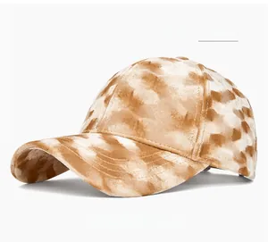 Detailed texture of polka-dot khaki corduroy baseball cap with high-quality stitching