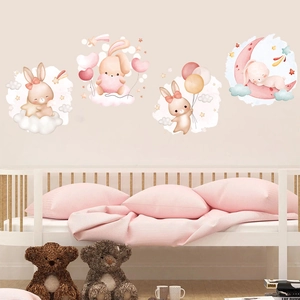 Detail of watercolor cartoon rabbits and clouds wall stickers in a cozy child bedroom
