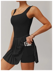 Detail of tennis dress side pocket and built-in shorts with square neck design