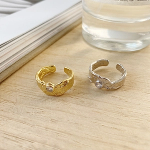 Close-up of S925 sterling silver stamp and hammered texture on adjustable rings
