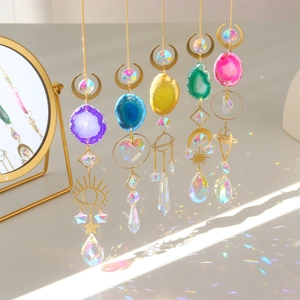 5-piece crystal suncatcher set with agate slices and prisms casting rainbow reflections