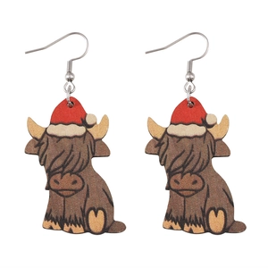 Christmas highland cow earrings with red hats on white background for festive style