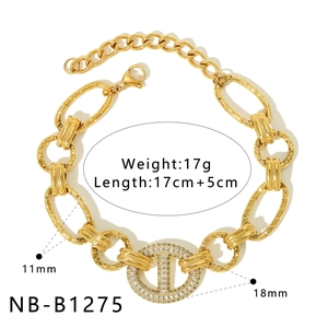 Detail of gold-plated stainless steel link bracelet with zircon heart and size labels