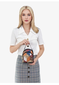Detail of a mini geometric patchwork backpack with red and blue leather blocks