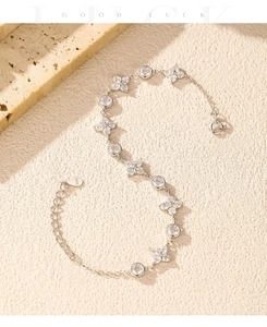 Detail of S925 sterling silver four-leaf clover bracelet with sparkling clear zircons