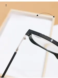 Detail of durable metal hinges on stylish large frame anti-blue light reading glasses