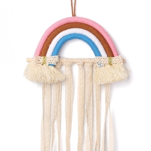 Rainbow woven wall hanging hair clip organizer with cream tassels and golden bows
