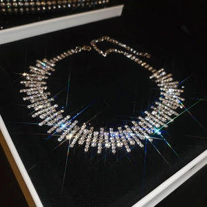 Detailed view of luxury multi-row crystal choker with sparkling starburst effect in jewelry box